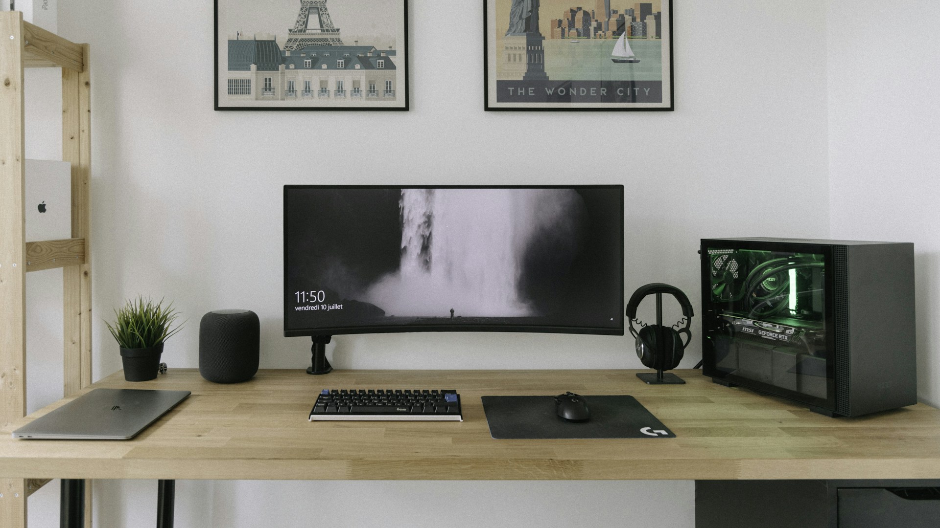 black flat screen computer monitor on brown wooden desk