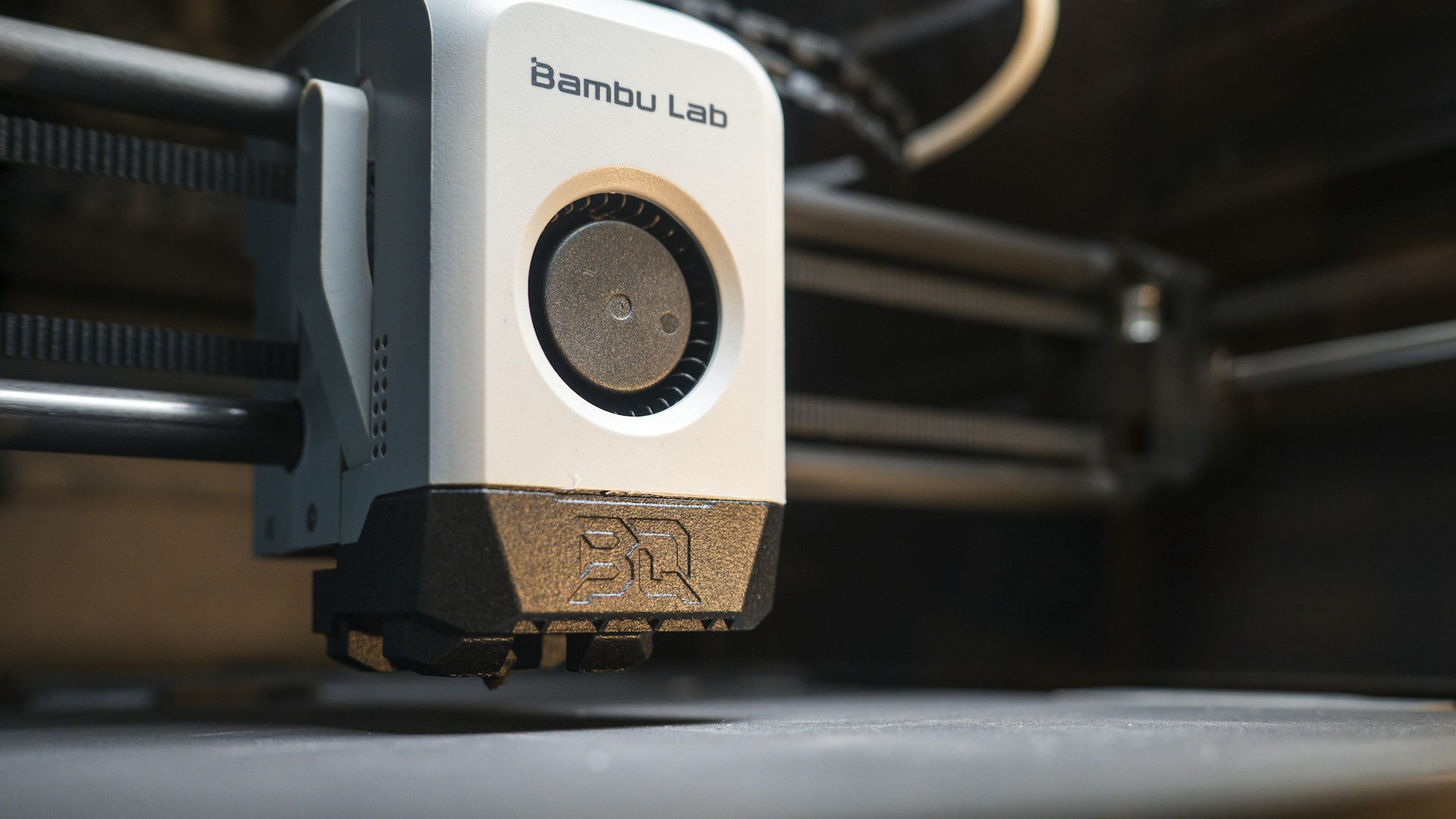 Close-up of a 3D printer head in operation