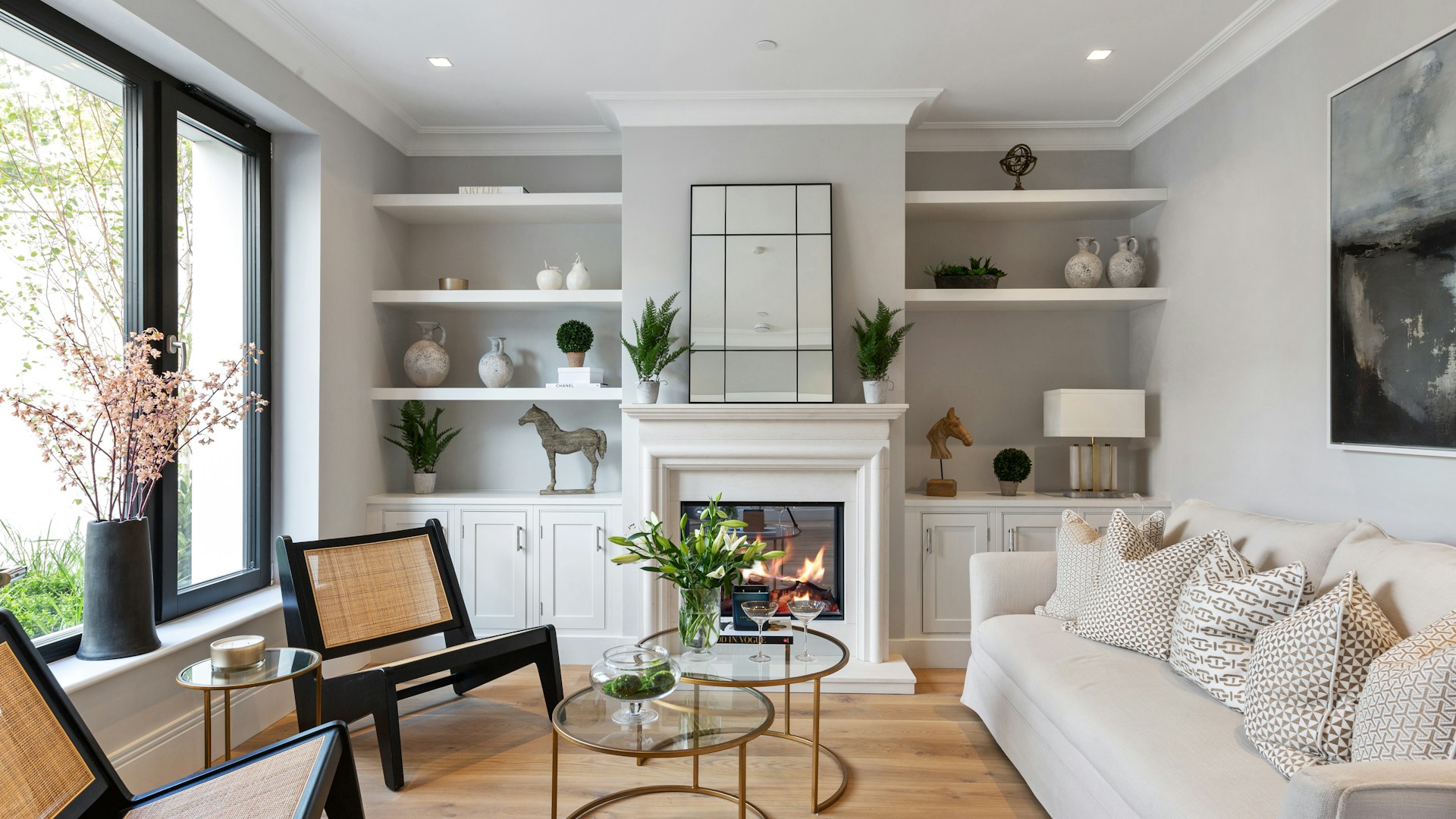 a living room filled with furniture and a fire place