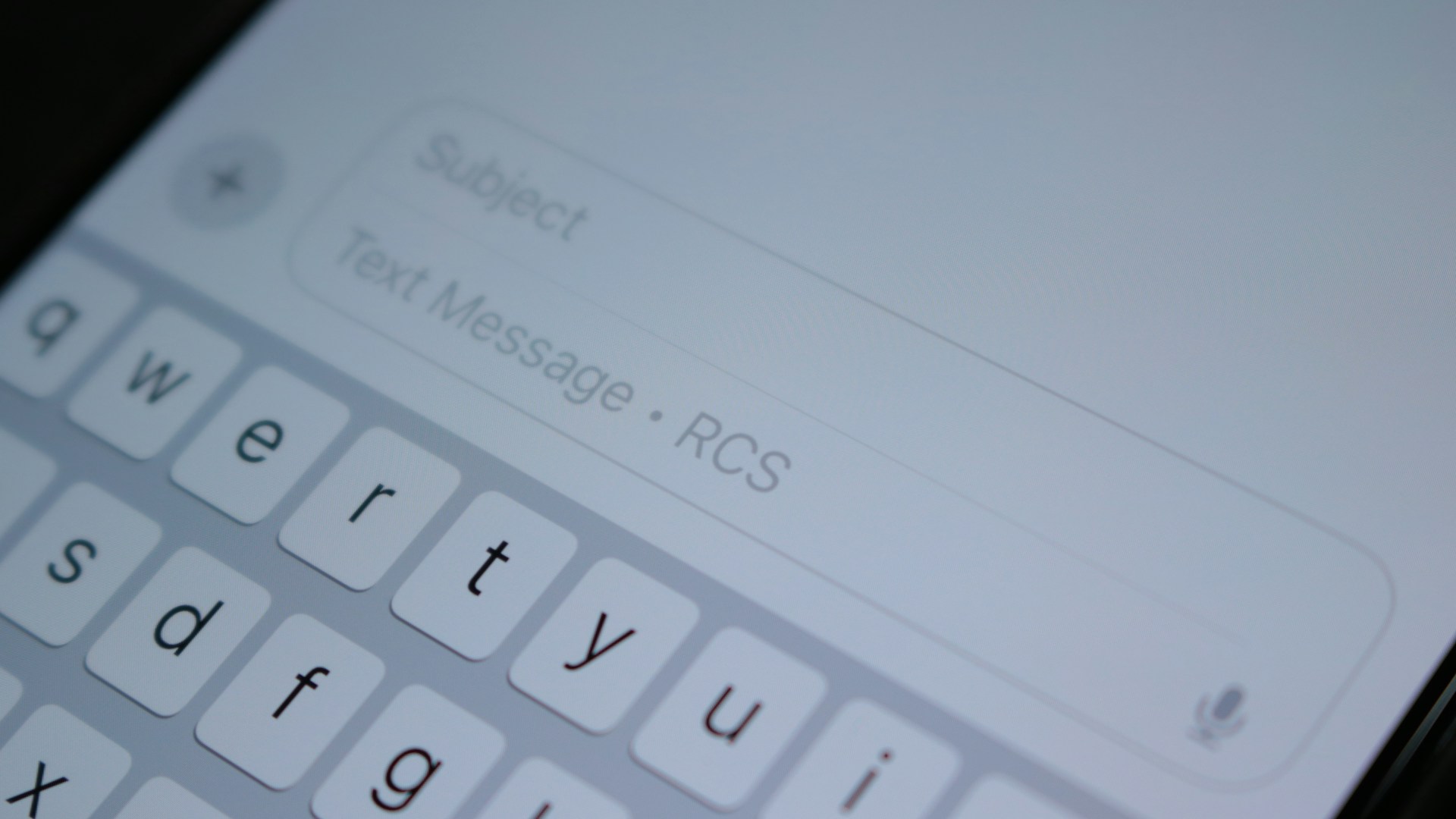 A close up of a cell phone with a keyboard