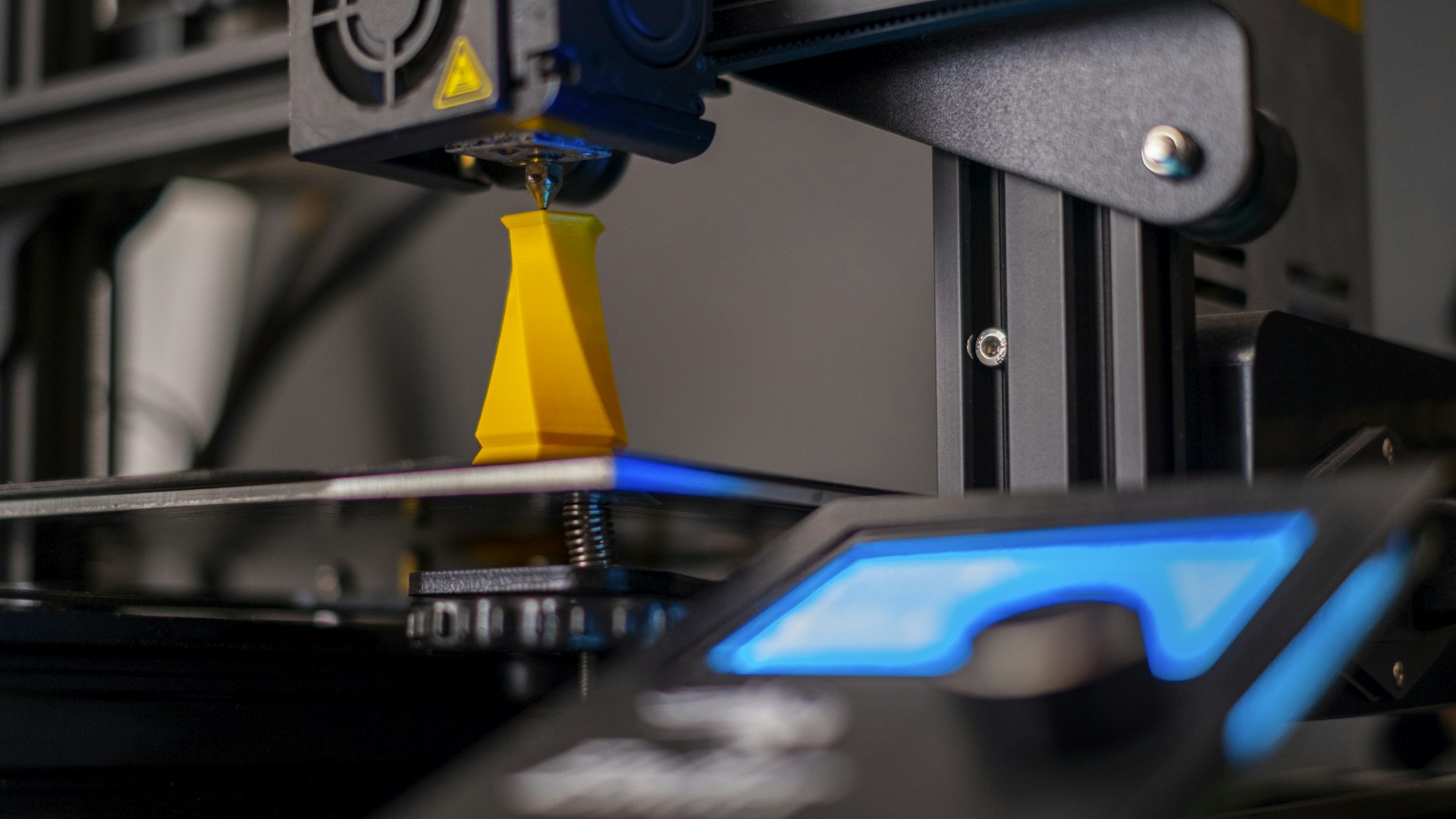 a close up of a machine with a blue light on it