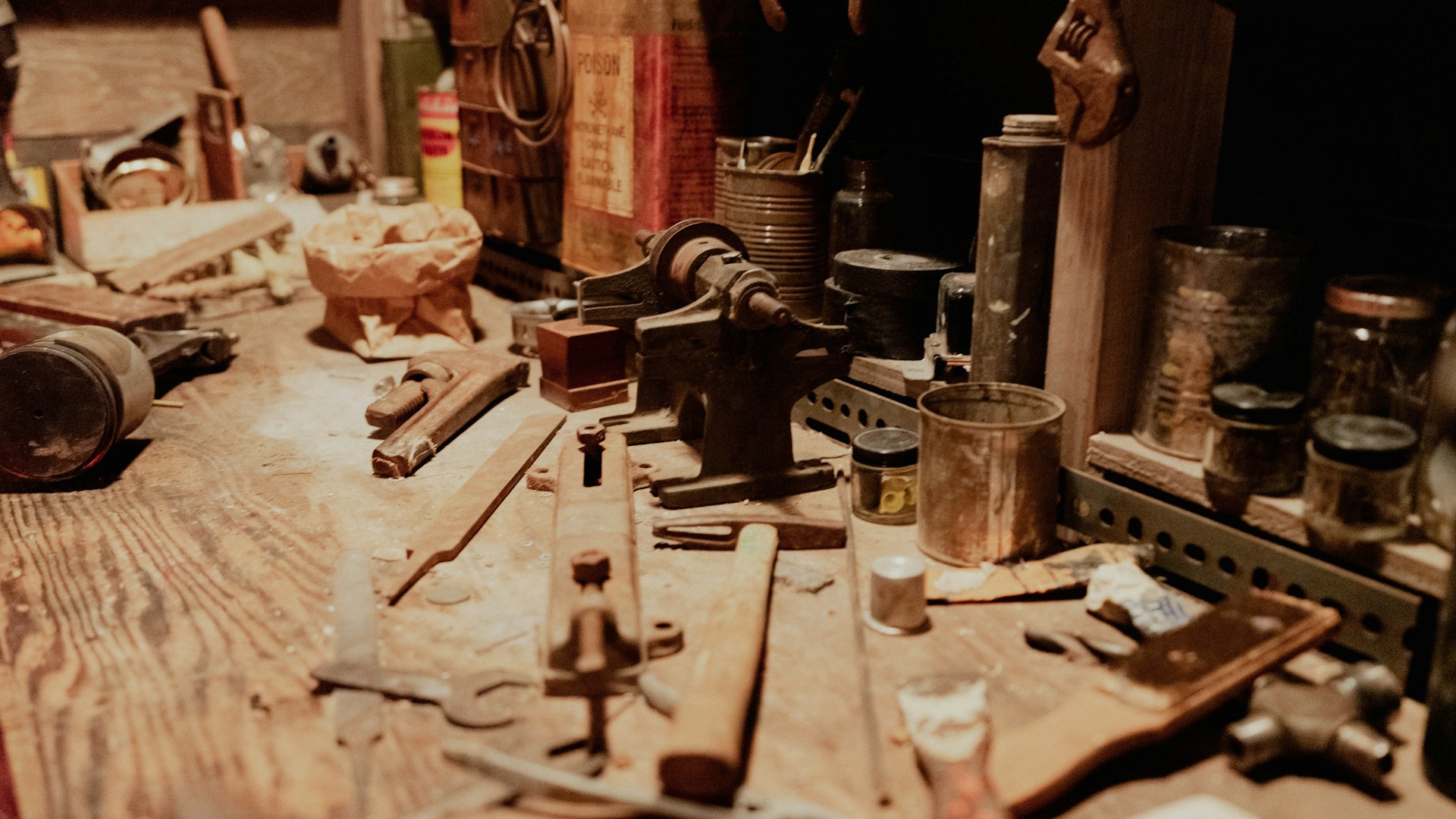 a wooden table topped with lots of tools