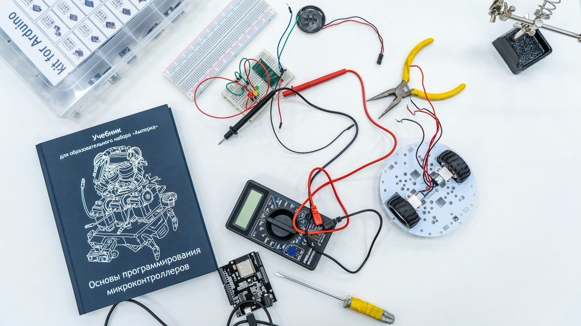 a book and some electronics on a table